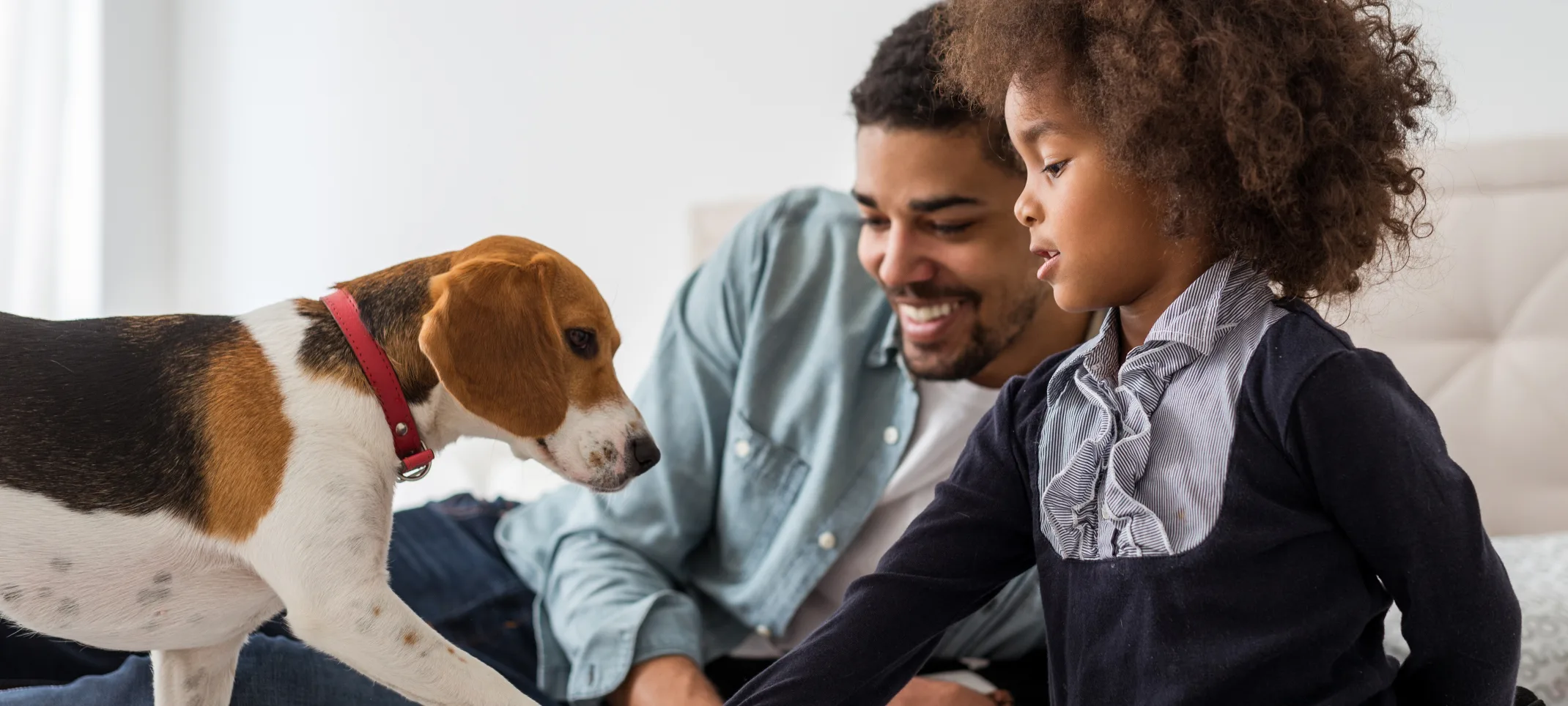 Father and son with a dog